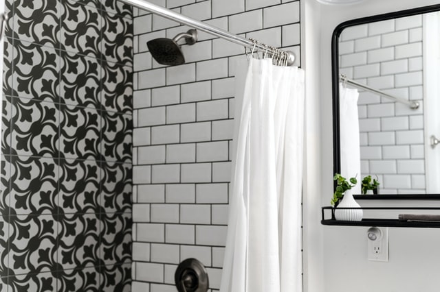 Modern Black and White Bathroom with Brass Accents - Bright Green Door