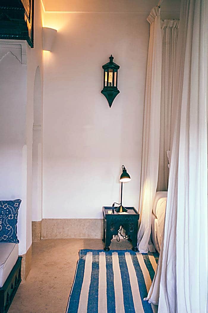 Moroccan white bedroom with blue accents