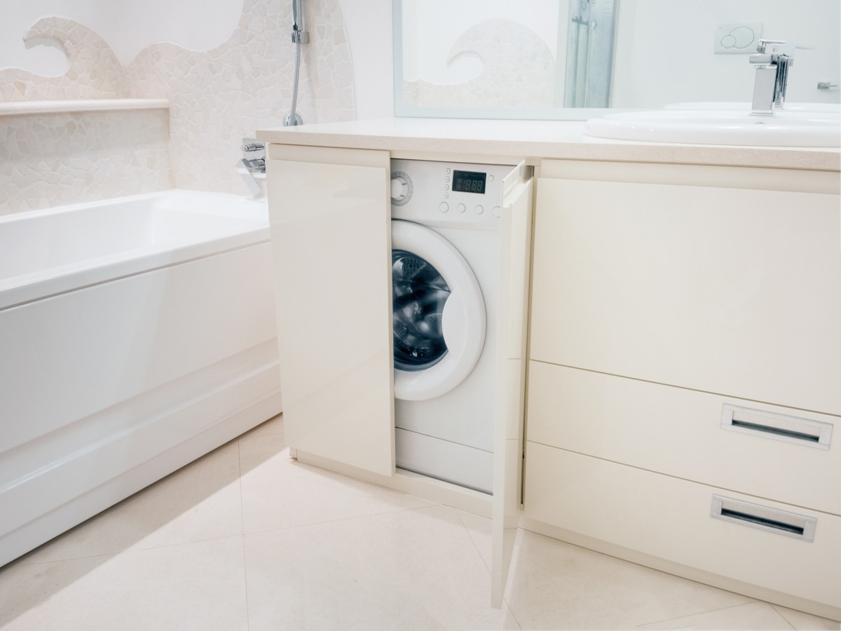 hidden washing machine in bathroom