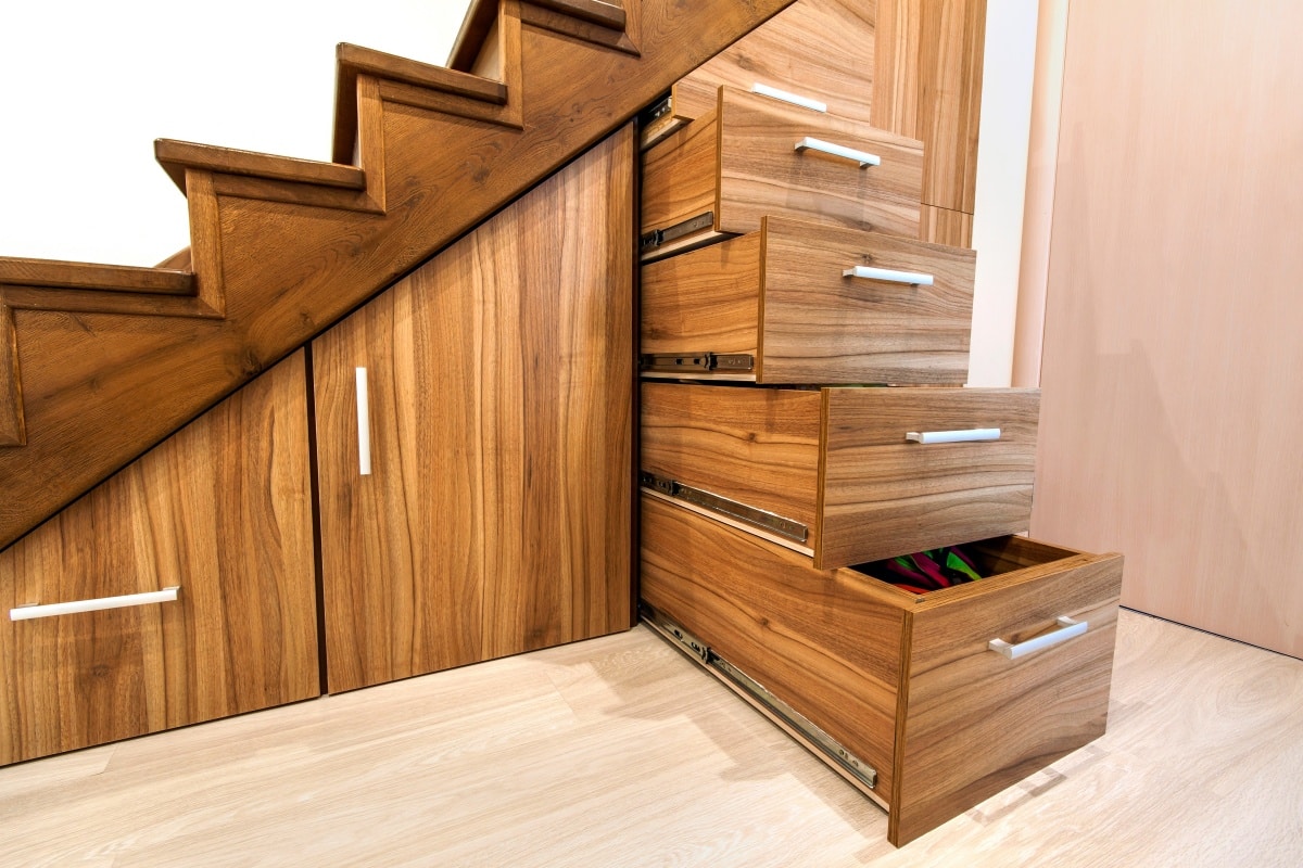 https://www.airtasker.com/blog/wp-content/uploads/2023/06/layered-pullout-storage-under-stairs.jpg