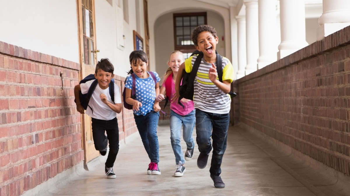 Kids running down the hall at the elementary school